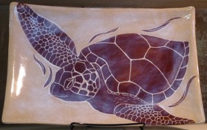 Stoneware platter, sgraffito carved tortoise design