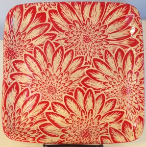 Stoneware plate, sgraffito carved mums design