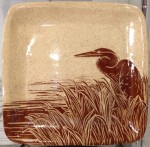 Stoneware plate, sgraffito carved heron design