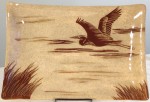 Stoneware platter, sgraffito carved heron in flight