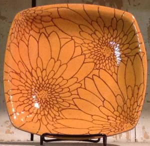 Stoneware bowl, sgraffito carved mums design