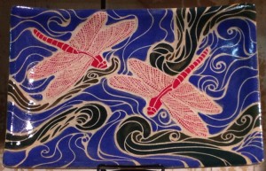 Stoneware platter, sgraffito carved dragonfly design