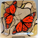 Stoneware plate, sgraffito carved monarch butterfly design