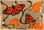 Stoneware platter, sgraffito carved monarch butterfly design