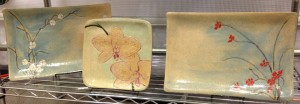 Stoneware tableware, sgraffito carved floral designs
