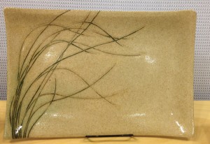Stoneware platter, sgraffito carved grasses design