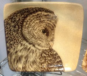 Stoneware plate, sgraffito carved owl design