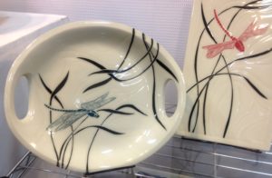 Stoneware platters, dragonfly designs