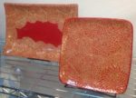 Stoneware platter and plate, sgraffito carved mums design