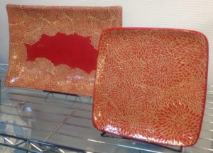Stoneware platter and plate, sgraffito carved mums design