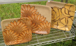 Stoneware plates, sgraffito mums design