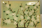 Stoneware platter with sgraffito carved blossoms motif