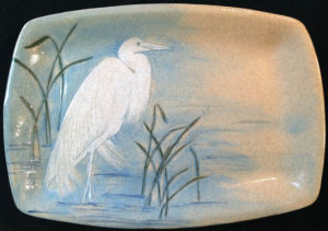 Ceramic platter, sgraffito carved great egret design