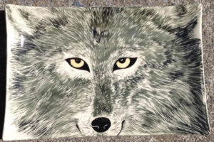 Ceramic platter, sgraffito wolf design