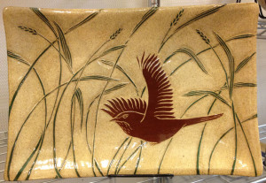 Stoneware platter, sgraffito carved wren and grasses motif