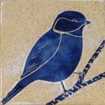 Stoneware tile, sgraffito carved chickadee design