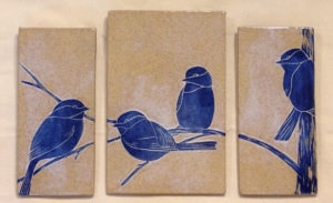 Stoneware triptych tiles, sgraffito carved chickadee motif