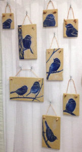 Ceramic tiles with sgraffito chickadee designs