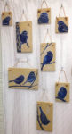 Ceramic tiles with sgraffito chickadee designs