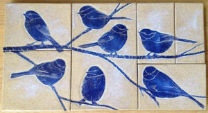 Mosaic wall tiles, sgraffito chickadee design