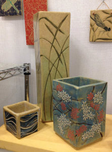 Square stoneware vases, sgraffito blossoms and grasses