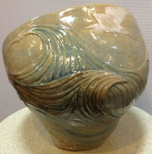 Ceramic vessel, sculpted seascape design