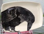 Stoneware platter, sgraffito carved raven design