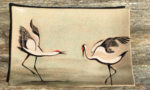 Stoneware platter, sgraffito carved dancing cranes design