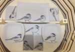Kiln load of chickadee tiles and tableware, unfired