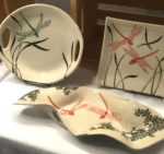 Display of dragonfly-themed tableware