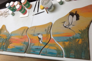 Studio photo; wall tiles work in progress; wetlands motif, herons, grasses