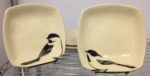 Two stoneware bowls with sgraffito carved chickadee designs