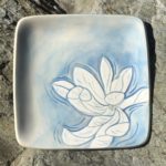 Square stoneware plate, sgraffito carved magnolia motif