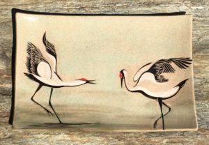 Rectangular platter, sgraffito carved design of dancing cranes