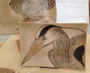 Stoneware platter, sgraffito carved heron motif
