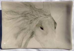 Stoneware platter, sgraffito carved horse design