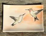 Stoneware platter, sgraffito carved hummingbirds motif