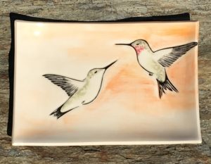 Stoneware platter, sgraffito carved hummingbirds motif