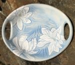 Round stoneware platter, sgraffito carved magnolias design