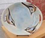 Round platter, sgraffito carved nuthatch design