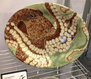 Oval platter, sgraffito carved octopus motif