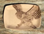 Stoneware platter, sgraffito carved owl design