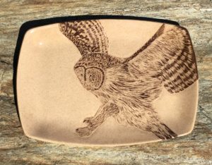 Stoneware platter, sgraffito carved owl design