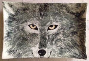 Stoneware platter, sgraffito carved wolf design