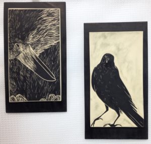 Two decorative wall tiles, sgraffito carved raven designs