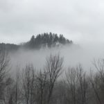 Photo of hillside in fog