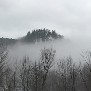 Photo of hillside in fog