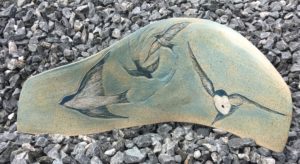 Decorative clay tile with swallows motif