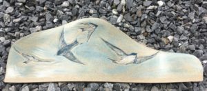 Decorative stoneware tile, swallows motif